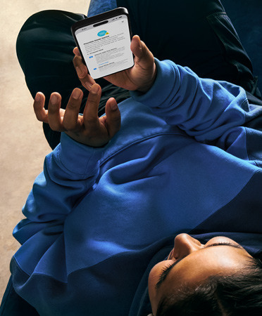 A person checks details of their possible sleep apnea alert on an iPhone