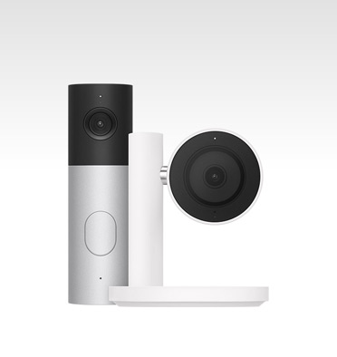 Apple Home Collection smart home camera, black lens and surround mounted on a white stand and arm