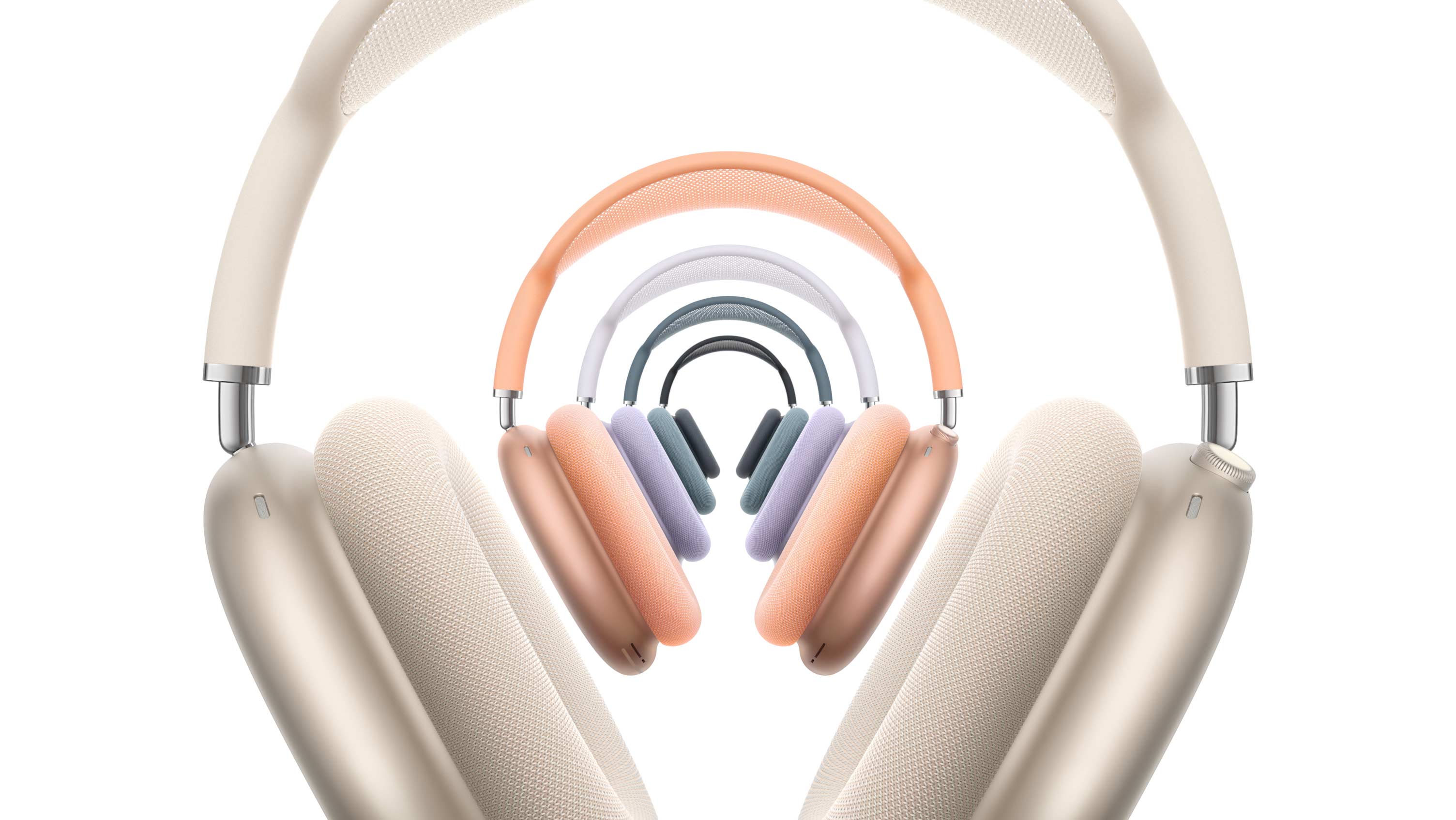 Five pairs of AirPods Max 2 headphones, front exterior, stacked, in Starlight, orange, purple, blue and midnight colours