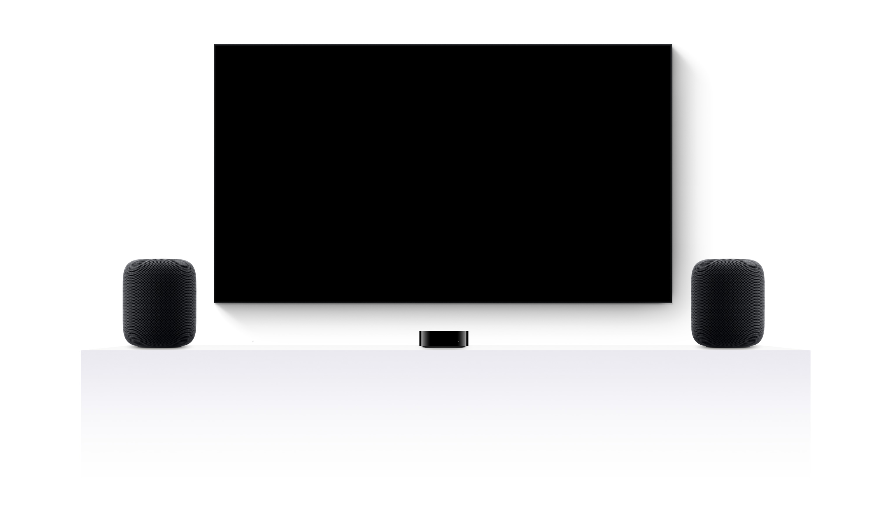 Apple TV 4k, two HomePods and a flatscreen television showing Jurassic World Rebirth