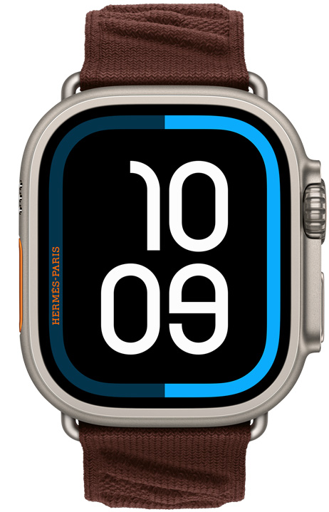 Apple Watch Hermès Ultra 4, Maritime digital watch face, titanium case, natural colour, right side exterior, Digital Crown, raised side button, paired with En Mer strap, Bordeaux colour (dark brown), textured knitted material