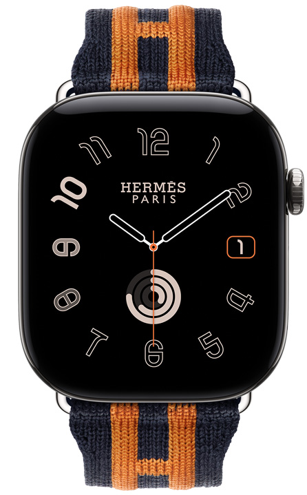 Apple Watch Hermès Series 12, Radial analogue watch face, (hour, minute and second hands, complications: date, Activity rings), titanium case, silver colour, right side exterior, Digital Crown, raised side button, paired with Rocabar Club strap, Bleu Nuit/Orange colour, dark blue knitted material with orange raised striped design that incorporates the Hermès H