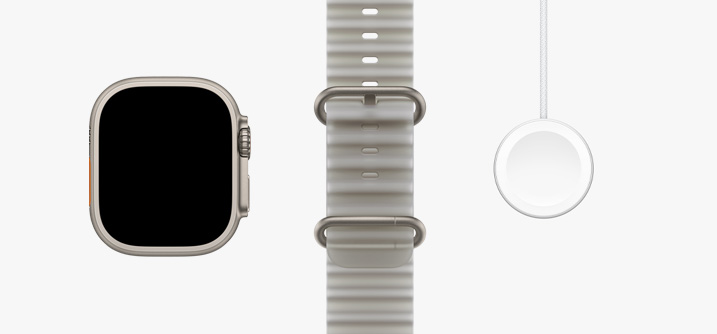 Apple Watch Ultra 4, natural titanium colour case, edge-to-edge display, translucent grey Ocean Band, Apple Watch Magnetic Fast Charger to USB-C Cable