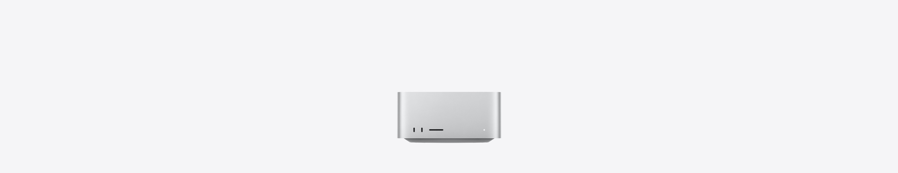 Vista frontal do Mac Studio, com duas portas USB-C, ranhura para cartões SDXC, luz indicadora de estado, base afunilada, parte superior plana, moldura reta com arestas arredondadas, na cor prateado