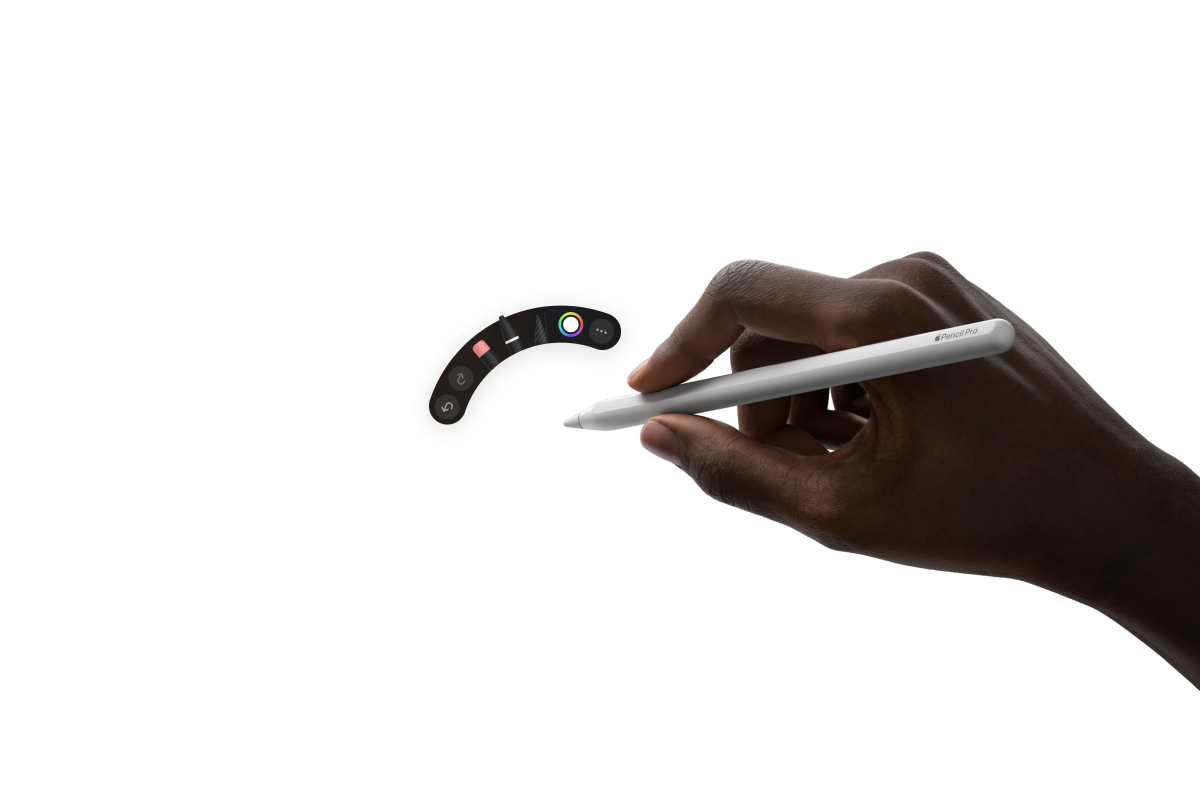 iPad Air, esivaade, käsi hoiab Apple Pencil Prod ja töötab Procreate’is illustratsiooni kallal koos käsitsi kirjutatud märkmetega