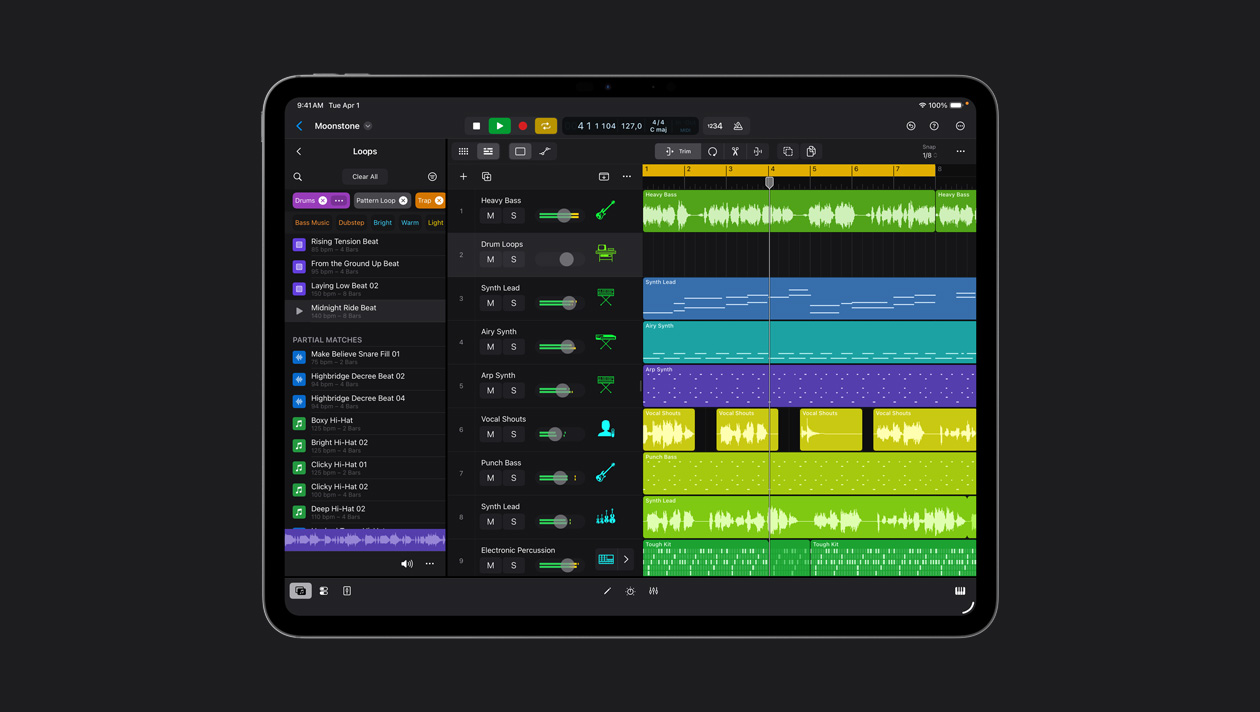 iPad Pro 13 screen showing Logic Pro workspace, Loops panel to the left, rows of soundwaves in different colours