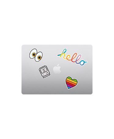 MacBook Air, top exterior, closed, silver color, multicolored stickers surrounding Apple logo