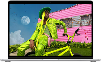 MacBook Air screen showing photo of person in colourful outfit, demonstrating colour range and resolution of Liquid Retina display