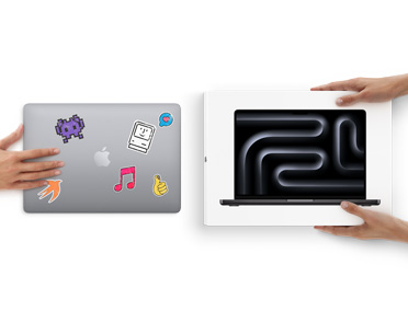 A hand slides a MacBook with stickers on the front towards two hands holding a new MacBook in the box
