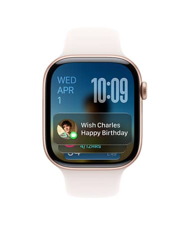 Apple Watch Series 11, Rose Gold with light blush strap, face shows date at top left, time on top right and Messages widget at bottom
