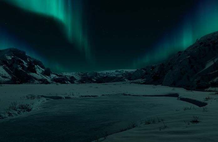 Apple Vision Proのビュー。暗い背景に雪に覆われた山とオーロラが広がるアイスランドの環境が映し出されている