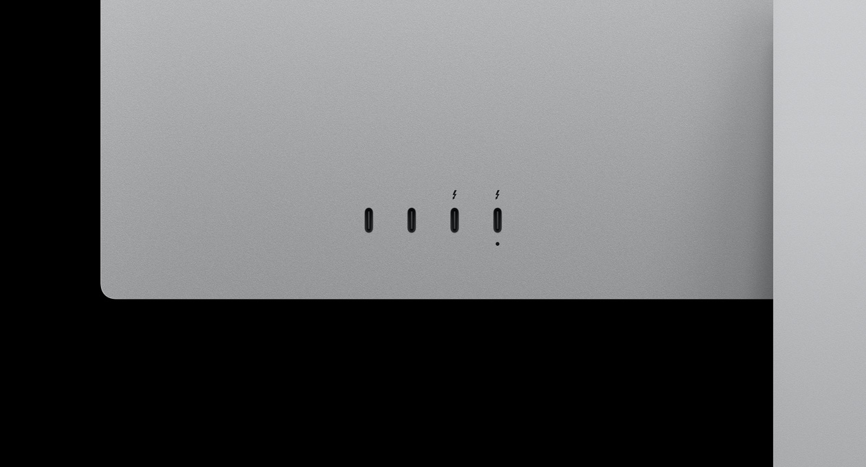 Close-up on rear of Studio Display XDR, highlighting two USB‑C ports and two Thunderbolt 5 ports